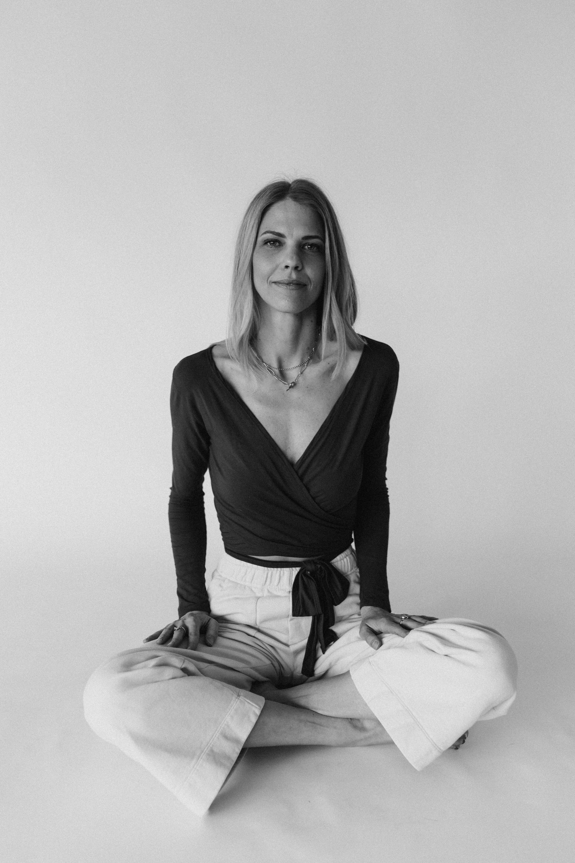 Person sitting cross-legged in meditation pose