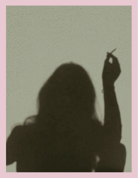 Person meditating in silhouette